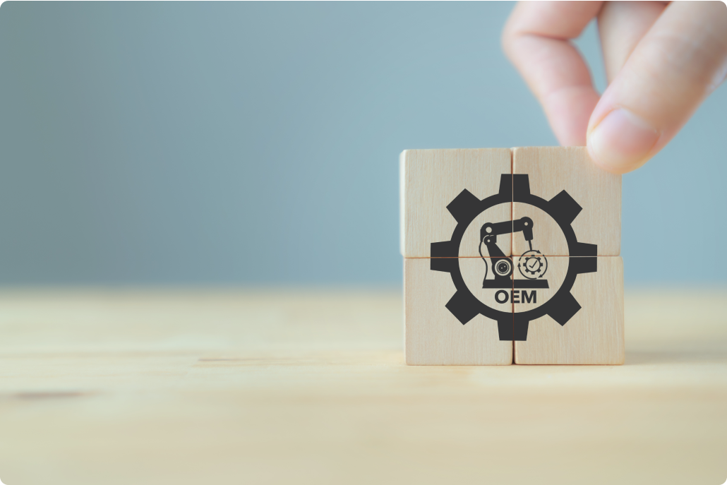 ロボットアームとギアのアイコンを描いた木製ブロック